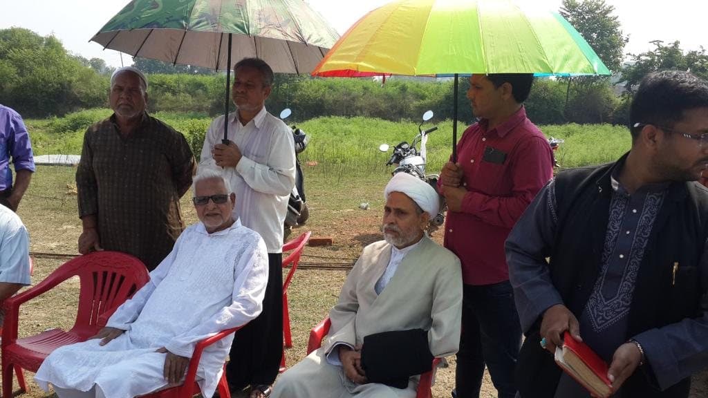 Elders and guests gathered on the site